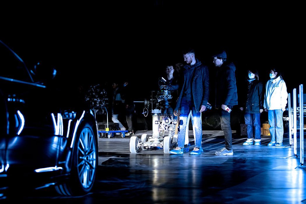 Film crew and camera rig on a night-time commercial shoot