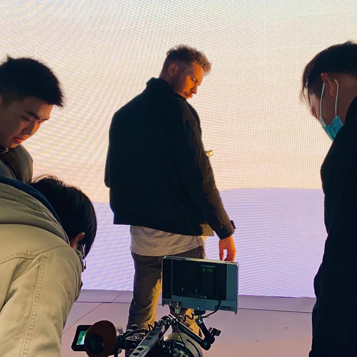 Thomas Gilbert with a camera crew on a virtual production set
